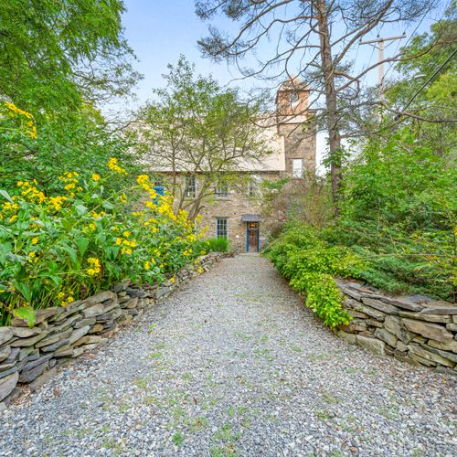 Local flora lines The Rifton's stunning garden pathway.