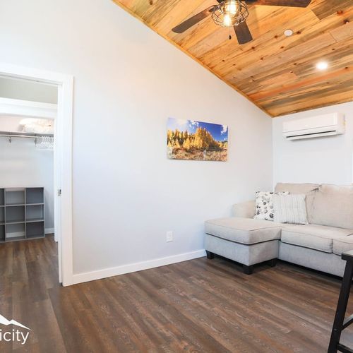 The living area leads into the bedroom.