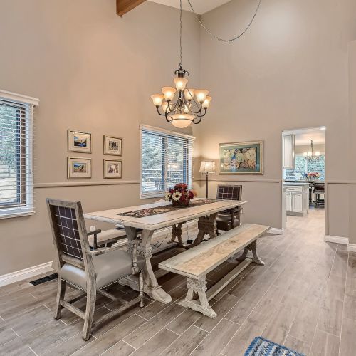Enjoy a meal under the rustic chandelier at a table with plenty of space for 8.