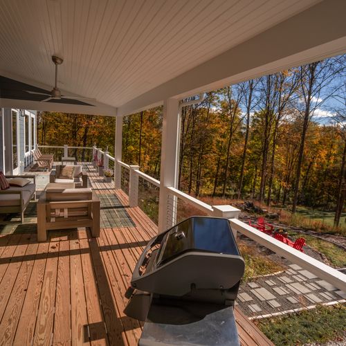 Enjoy grilling on the covered deck with easy access to the kitchen