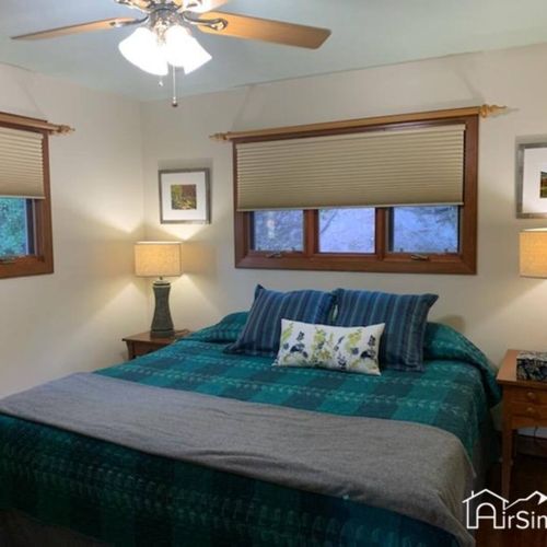Bedroom 1 is located on the upper floor and features a luxurious king-sized bed and ample closet space to store all your belongings. You'll wake up feeling refreshed and energized, ready to take on the day's adventures.