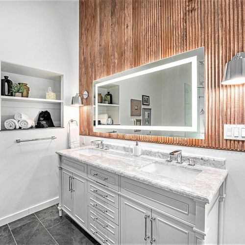 Enjoy the luxury of a beautiful ensuite bathroom, featuring a double sink vanity for added convenience and style.