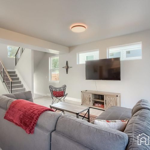 Sink into the comfy couches and stream your favorite show on the 65” living room tv.