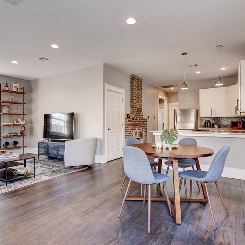 Charming dining area w/ natural light & seating for four — great for family meals together.