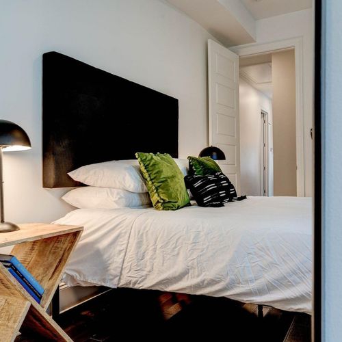 Third bedroom featuring a queen bed & curated decor for a comfortable stay.