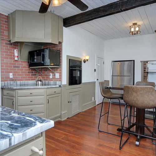 A breakfast nook that seats four, a fridge and an original wood burning stove!