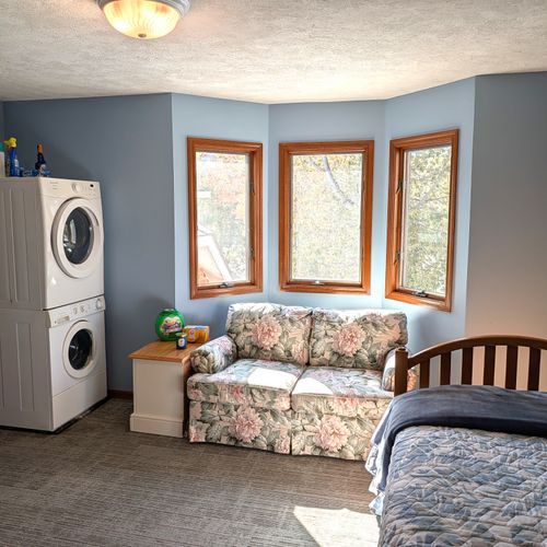 BEDROOM #5 (SECOND FLOOR):  Mixed up bedroom on the second floor with a trundle bed, loveseat, and a washer and dryer.