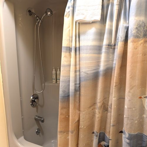 BATHROOM #3:  This is a "jack and jill full bathroom" with private entrances from both Bedroom #3 and Bedroom #4.  Includes 2 separate sinks each with a mirror and vanity along with a toilet and a combination tub and shower.