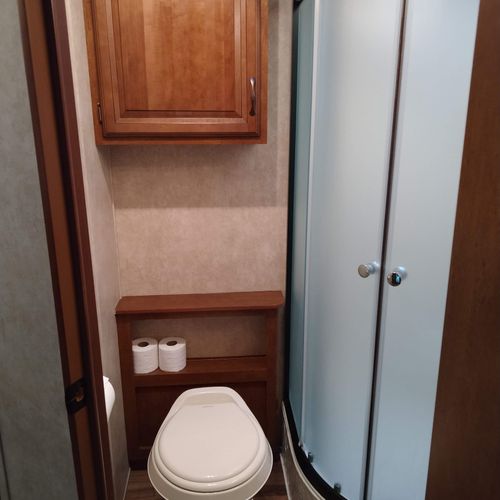Bathroom #2:  full bathroom with a shower, sink, vanity, and toilet.