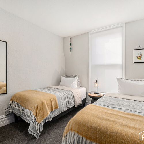 Our twin bedroom is not just cozy; it comes with a full-size mirror for a touch of glamour.