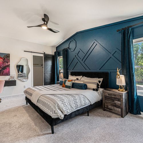 Step into a stylish master suite that epitomizes luxury and comfort.