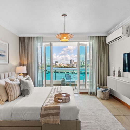 Relax in luxury: Plush king bed, stylish furnishings, and a tranquil atmosphere.
