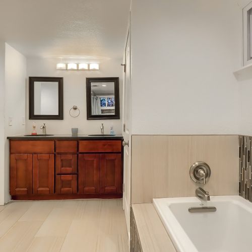 Soak in relaxation in our newly tiled tub in the lower level master ensuite bathroom.