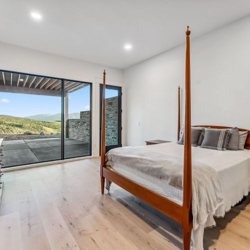 Queen bedroom with breathtaking views—wake up to scenes you’ll never forget.