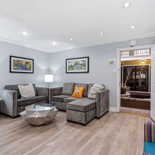 Kick back in this welcoming living area w/ plush seating & warm natural light.