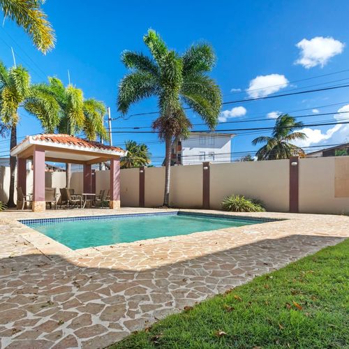 Escape to a private garden paradise with a shimmering pool