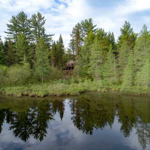 Exterior:  goose creek with the lodge in the background.