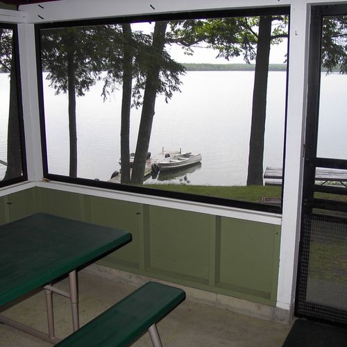 Front porch:  the cabin has a lovely screened-in porch with a picnic table and a great view of little platte lake