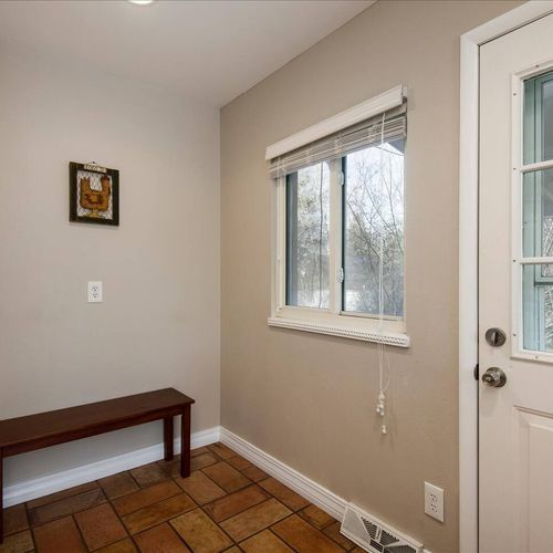 The kitchen naturally flows to a mud room and the covered patio space.