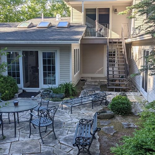 Exterior:  another view of the backyard patio. (note that the stairs go up to bedroom #4. )