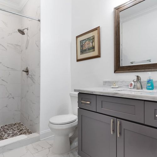 Second bathroom w/ sink & toilet — functional & fresh.