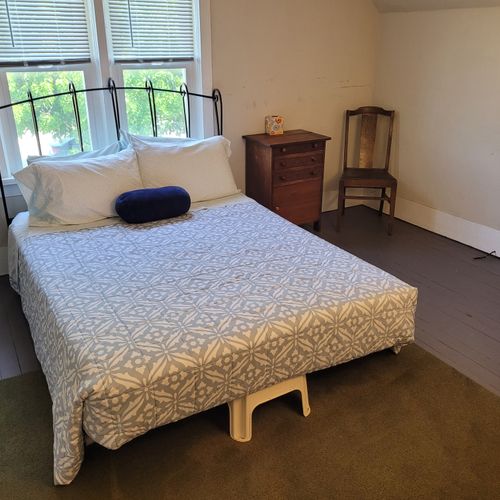 BEDROOM #1 (SECOND FLOOR):  Features a queen-size bed, baby crib, and closet.