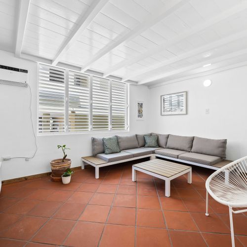 Cozy Living Room with Style. Enjoy the comfort of a sectional sofa and the charm of this inviting living space.