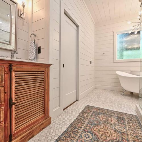 The private bath with a walk-in shower and soaking tub.