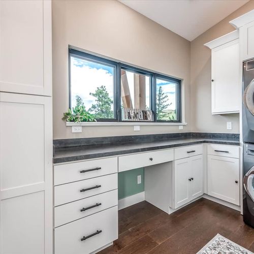 - multi functional laundry space features built in cabinetry and a cozy desk nook
- natural light flows through the wide window while you work, fold, or plan the day
- clean, organized, and practical, ideal for extended or working stays