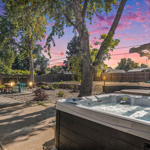 Soak in the outdoor hot tub and unwind under the open sky, perfect for relaxing any time of day.