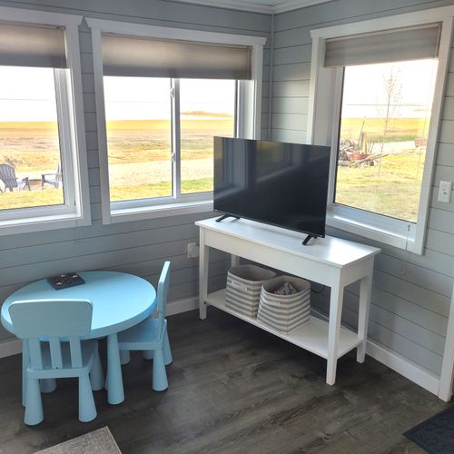 SUNROOM:  The home has a very fun and family-friendly sunroom off of the living room.  It features great views of Lake Huron.