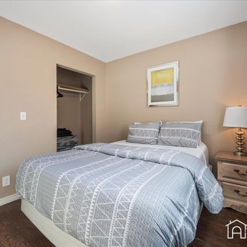 Wake up refreshed in the bedroom upstairs, filled with natural light and equipped with a comfortable queen bed.