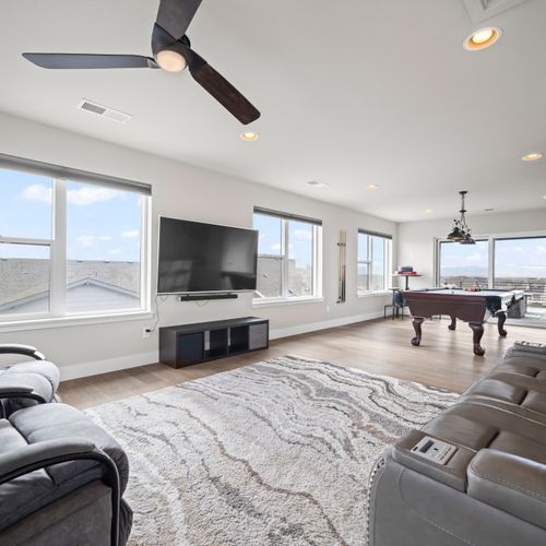 Ultimate hangout room with large tv, pool table, stunning views.