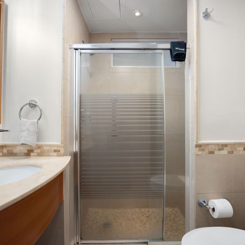 Clean and modern bathroom with a spacious walk-in shower for a refreshing start to your day.