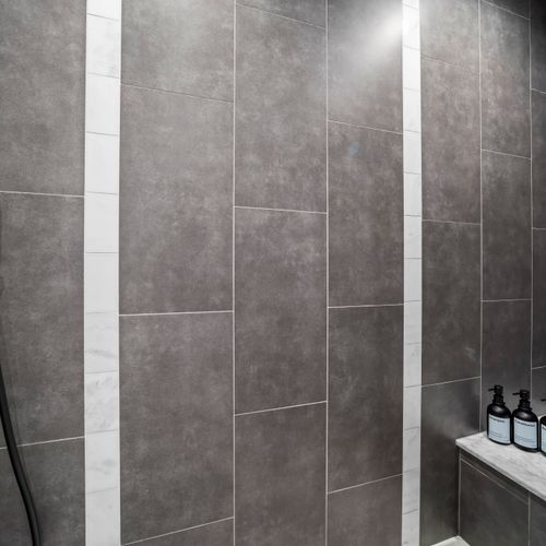 Tiled shower with clean lines and modern finishes.