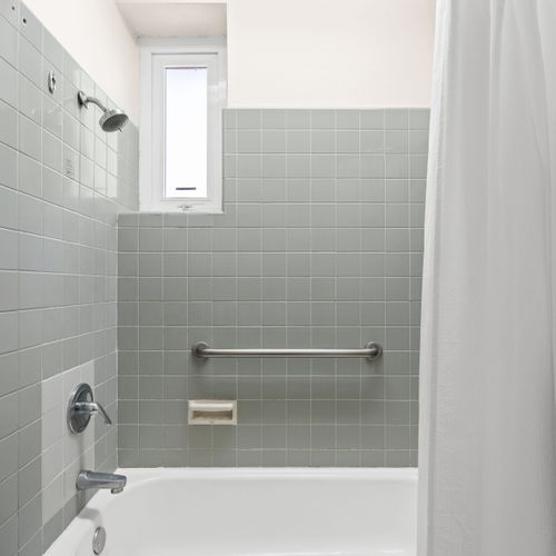 Olimpo | Room With Balcony 35 Enjoy a quick, invigorating shower in our sleek and renovated bathroom.