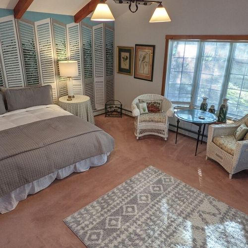 Bedroom #1 (first floor):  this bedroom has a long private entryway that opens up into an incredibly large bedroom with its own king size bed, television, library, sitting area, and private en suite bathroom.