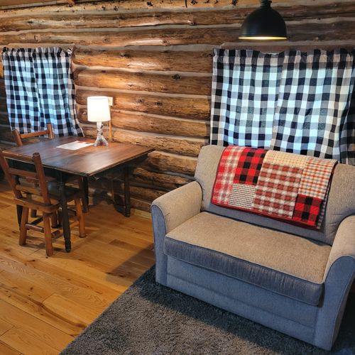 Interior:  the sofa bed and dining table