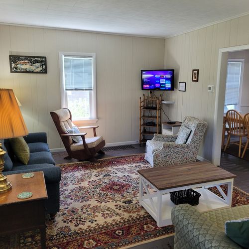 LIVING ROOM:  Very comfy and cozy living room with 2 sofas, a rocking chair, coffee table, and streaming television.