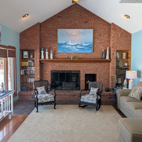 LIVING ROOM #1:  The primary living room, which has a great view of Big Platte Lake!  (Note that the fireplace is not usable.)