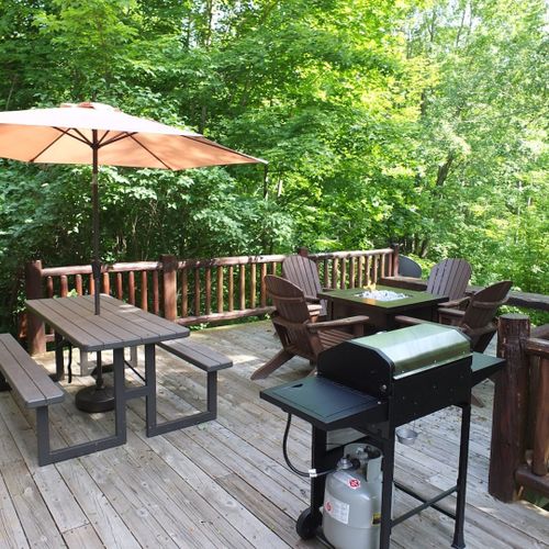 Overview:  the large backyard deck in the summer.