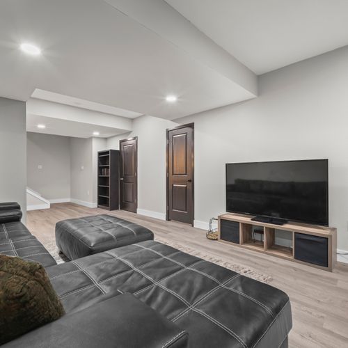 Entertainment room built for movie marathons and game-day excitement.