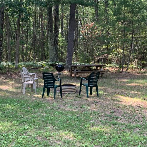Exterior:  the backyard bonfire pit and chairs