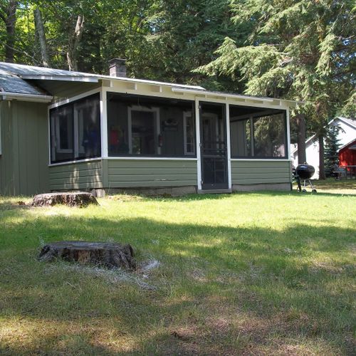 Exterior:  the front porch of the cabin in summer
