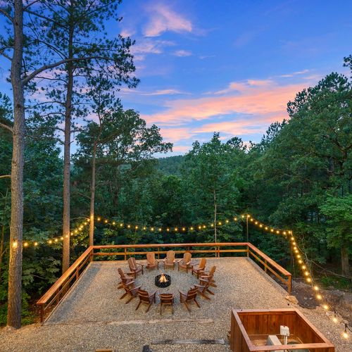 Down the stairs you will find a fire pit with Adirondack chairs!