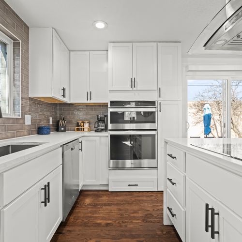 Clean, sun-filled kitchen fully equipped for group cooking and effortless gatherings