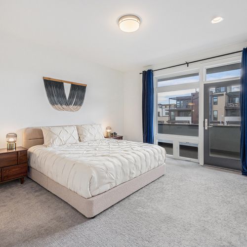 Less is more in this tastefully minimal king bedroom, where elegance meets space.