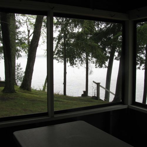 Front porch:  the cabin has a lovely screened-in porch with a picnic table and a great view of little platte lake