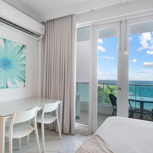 Coffee with a view! This balcony offers the perfect setting to start or end your day overlooking the ocean.