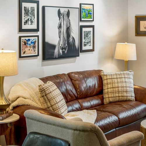 Relax and recharge in the living space, designed with warm hues and soft materials for a homey vibe.